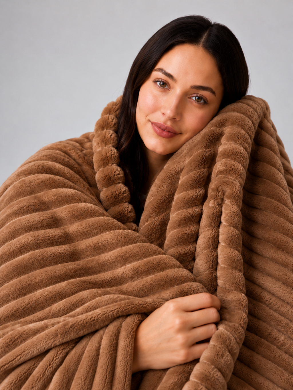 26. MoraNest Deep Coffee blanket - woman hugging blanket