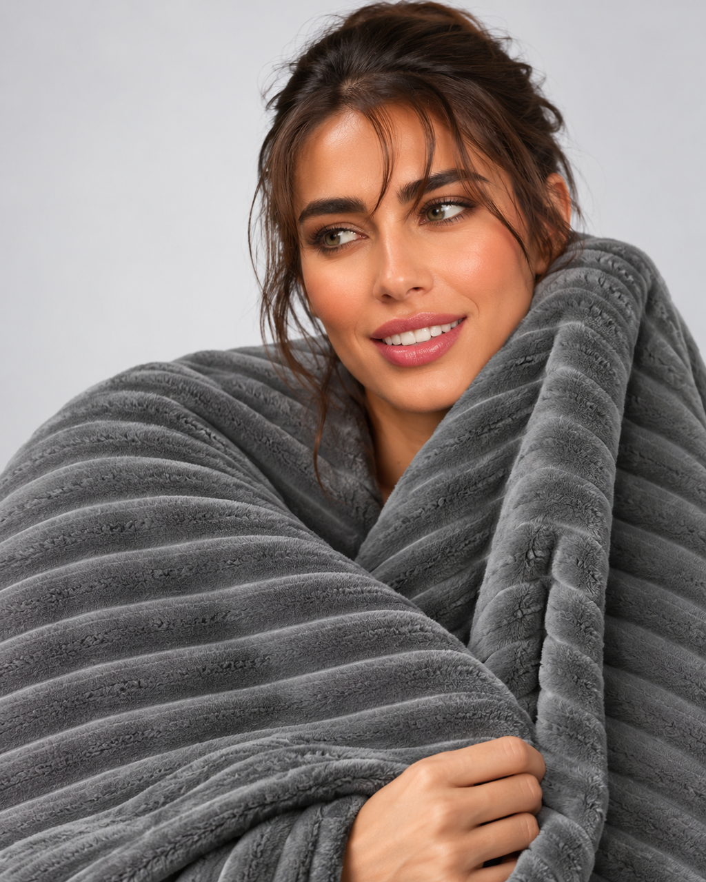 22. MoraNest Silver grey blanket - woman hugging blanket