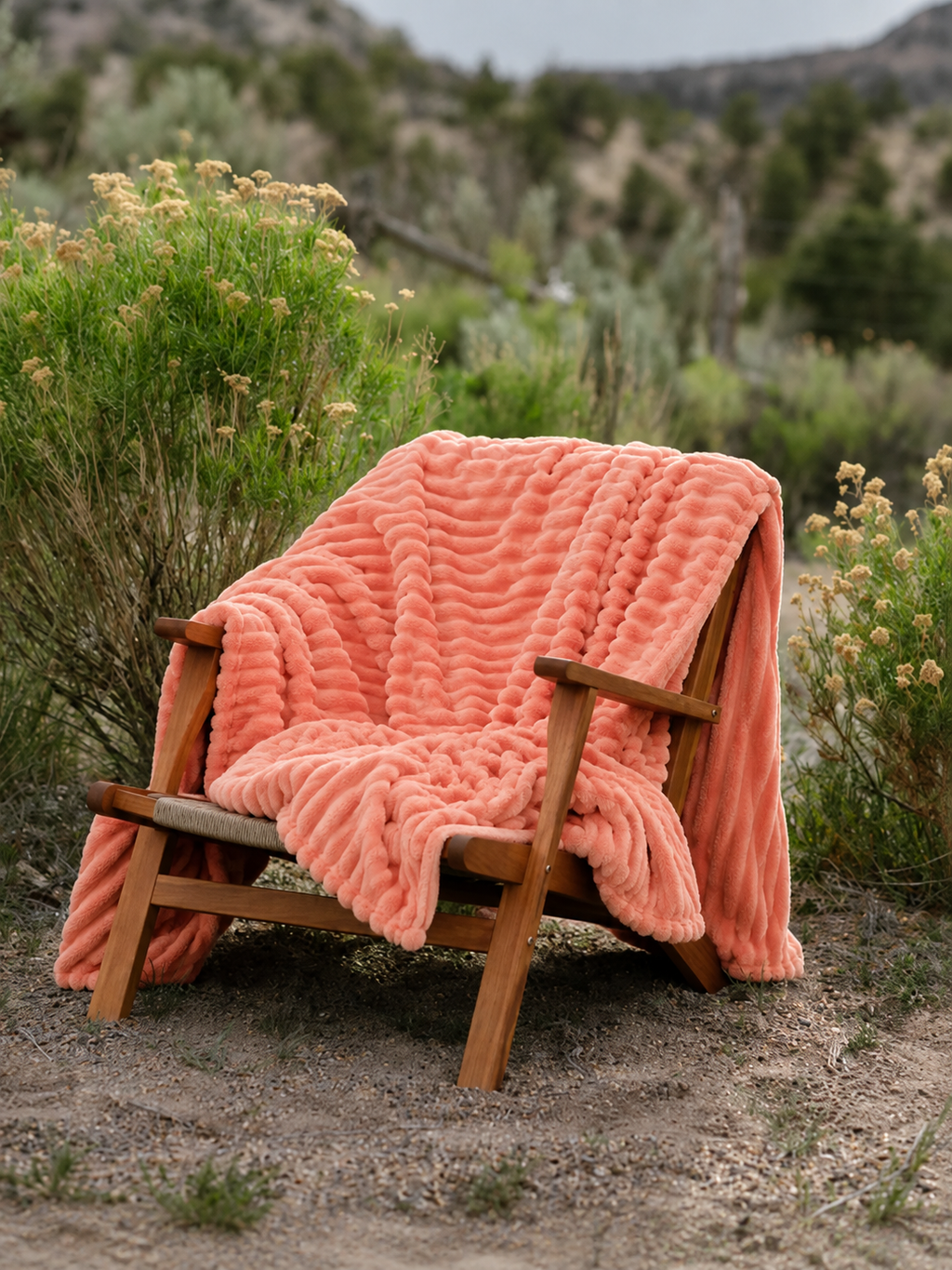 13. MoraNest Orange blanket - draped over outdoor chair