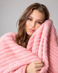 1. MoraNest Powder blanket - woman hugging blanket
